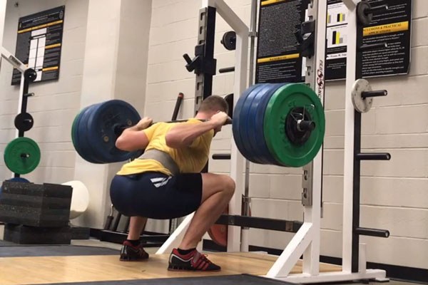nik aston squatting