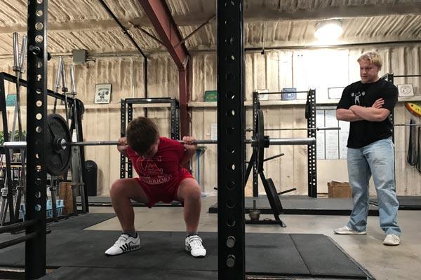 kirk training his squat