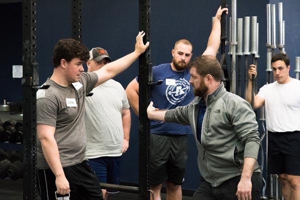 brent teaching a group of lifters