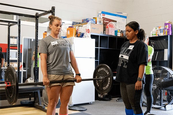 female lifters barbell training