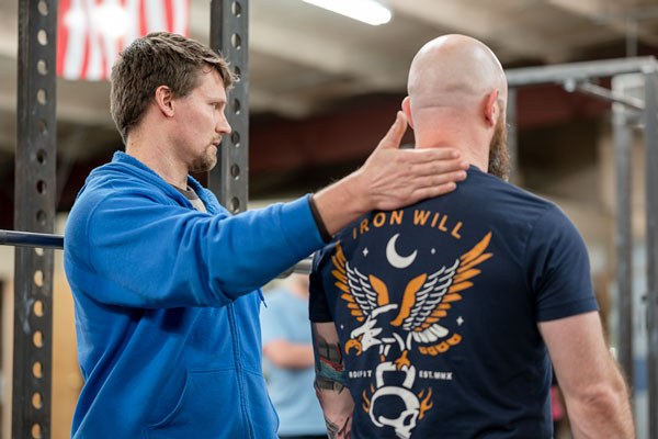 phil meggers teaches bar position at the starting strength seminar