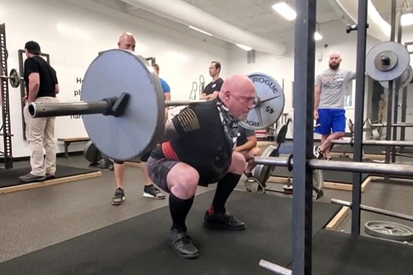 gary working on knee position at the bottom of the squat