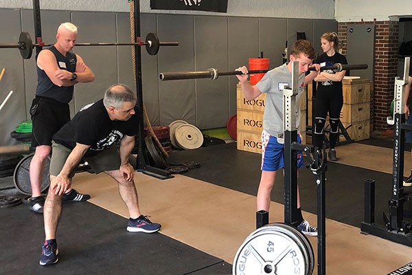 liam at a starting strength squat camp