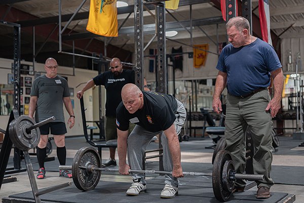 rip coaches a lifter on his deadlift