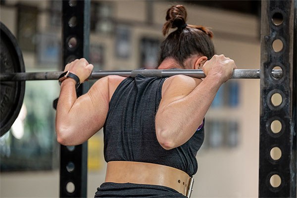 muscles bunched under the bar in a squat