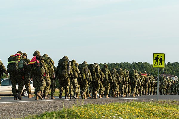 line of soldiers ruckmarching