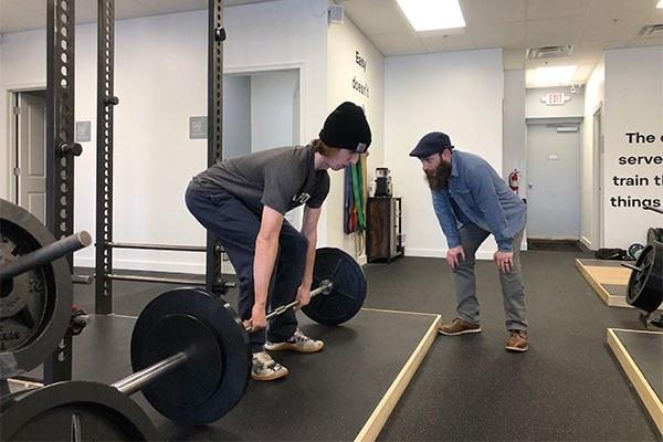 bruce trout teaches robert to deadlift at starting strength columbus