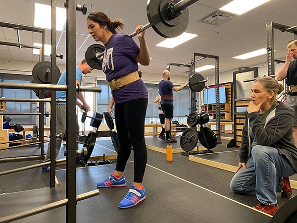 mia inman coaches lina through her last set of squats