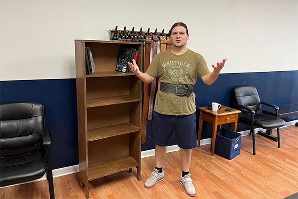 kendall with a bookcase made by friend and coach andrew lewis