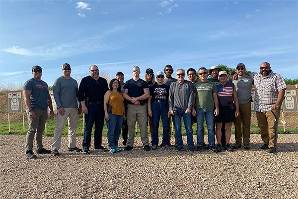 lift shoot fight camp group photo