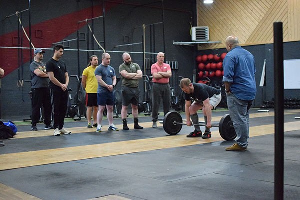 david sets up for a deadlift at the starting strength training camp in manchester