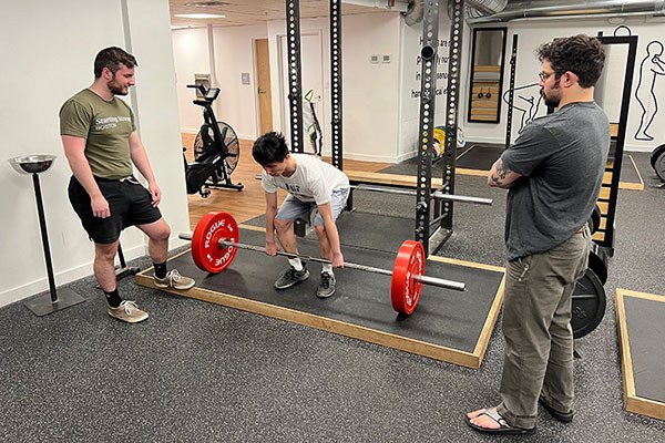 victor learns how to deadlift at starting strength boston open house