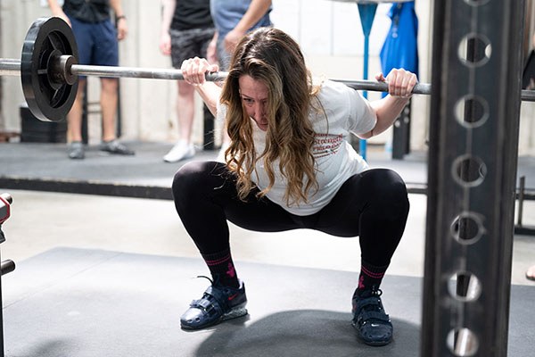 lifter at the bottom of a squat