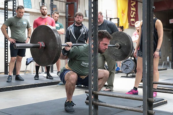 lifter driving out of the bottom of a squat