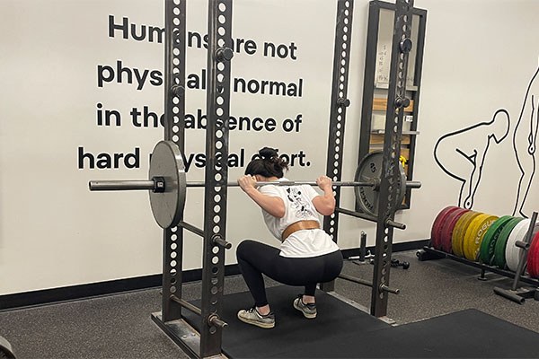 yiping squats 135 for the first time at starting strength austin