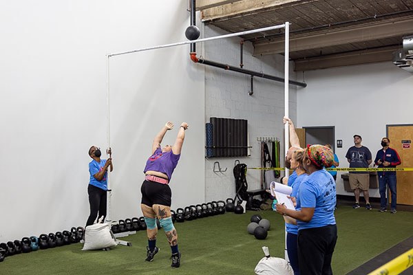 katie mansi in triple extension in the weight for height event