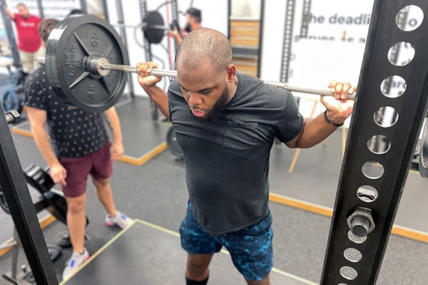 albert squatting at the starting strength training camp in orlando