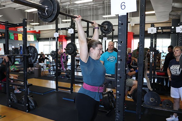 sarah jones presses in the ironfest competition at testify strength and conditioning
