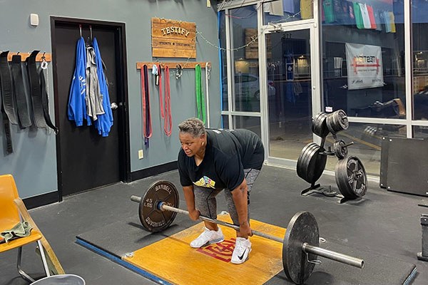 myra prepares for a pr deadlift set of five with the big wheels