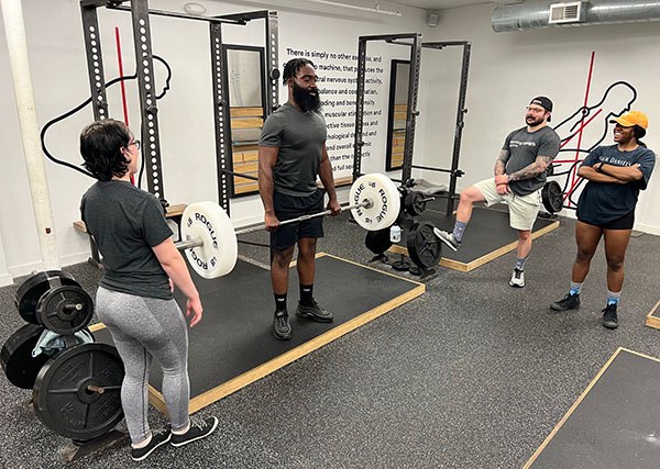 coaches teach the deadlift at a starting strength boston open house