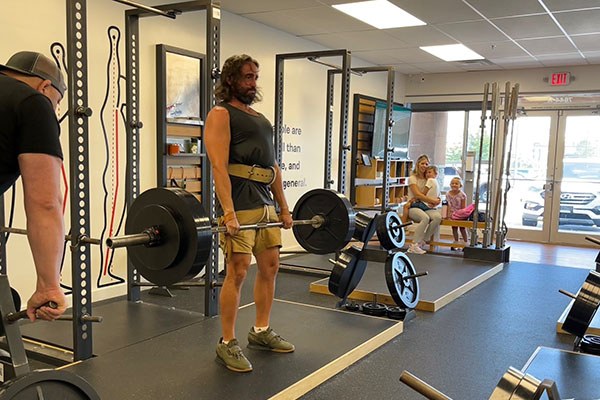 jacob deadlifts as his family watches at starting strength cincinnati