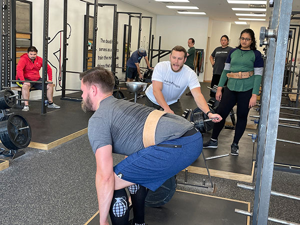 chris coaches dave into the correct deadlift start position