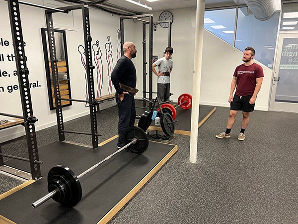 father and son train together at starting strength boston