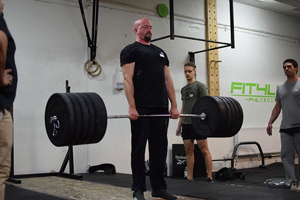 eric finishes a deadlift at the starting strength training camp in sweden