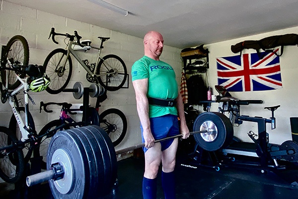 ollie locks out a deadlift in his home gym in surrey uk