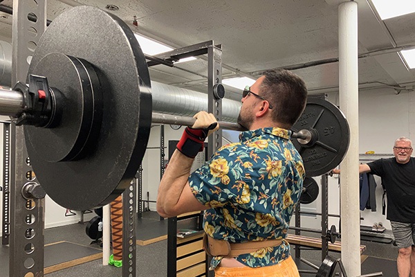 jeff pressing while wearing colorful clothing