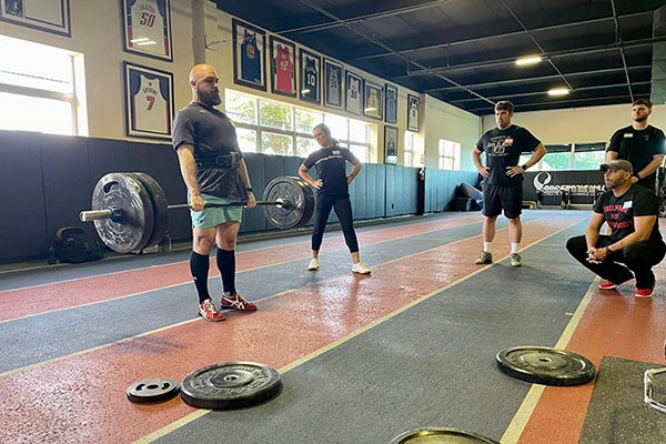 inna koppel coaches the deadlift at a starting strength training camp
