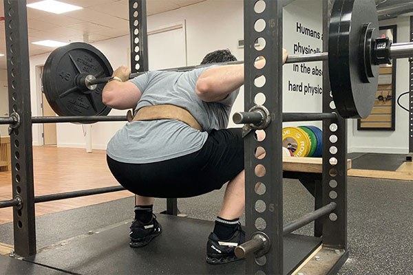 nick at the bottom of a squat as he sets a new pr of 240 x 5