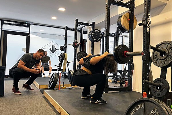 iben squats at the starting strength training camp in belgium