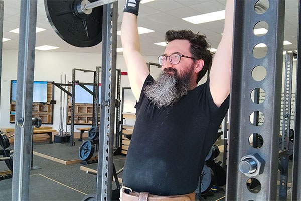 mike locks out a press at starting strength austin sunset Valley