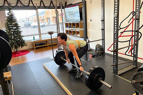 lifter setting up to pull 265 for three at starting strength cincinnati