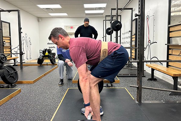 lance works through a set of deadlifts at starting strength atlanta