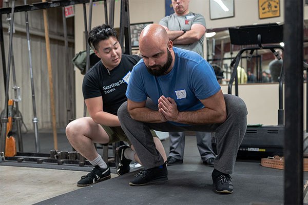 jacob teaches the bottom position of the squat