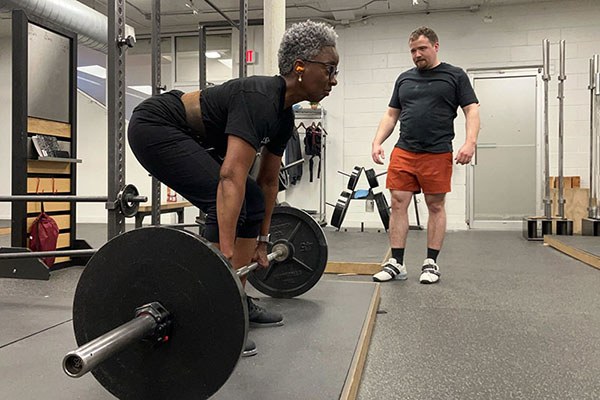 jacquie sets a deadlift pr during her linear progression at starting strength boston