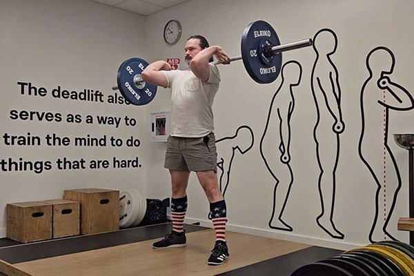 alex standing with a racked clean