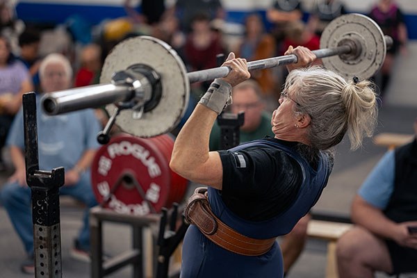 a lifter pushing through the middle of a press