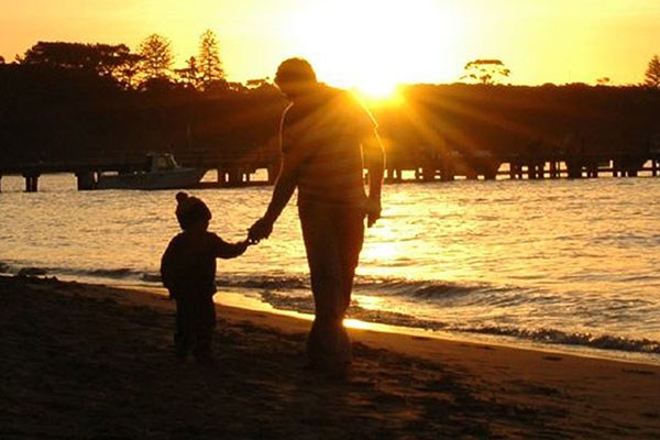 silhouette of parent and child