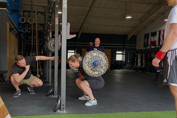 jacqui squats at the training camp in manchester