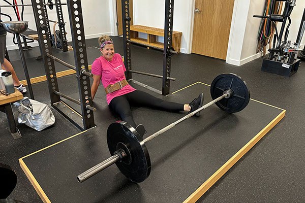 kim sprawls on the floor between sets