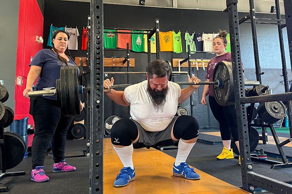 rob at the bottom of a 445 lb squat