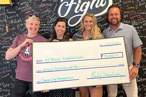 emily socolinsky delivers funds raised for the ulman house