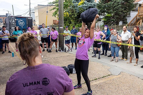 zan competes in the sandbag carry