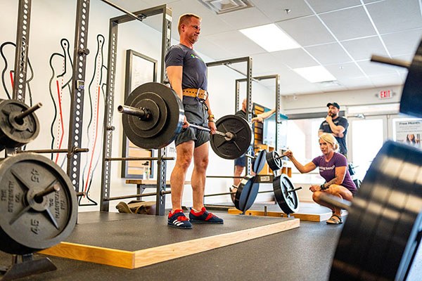 marcus locking out a deadlift at 295