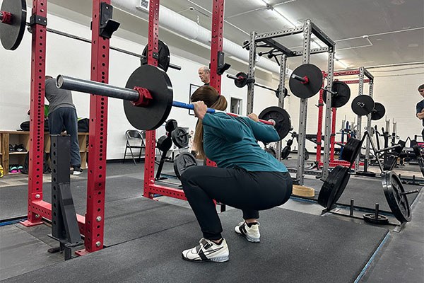 krista works on her squat bottom position as she warms up