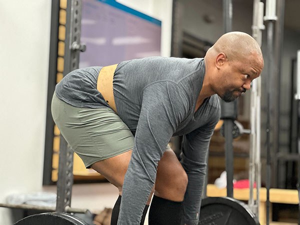 travis prepares to start a deadlift