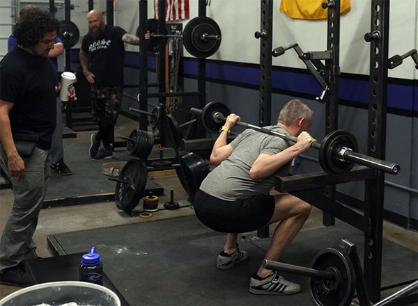 santana coaches a lifter's squat